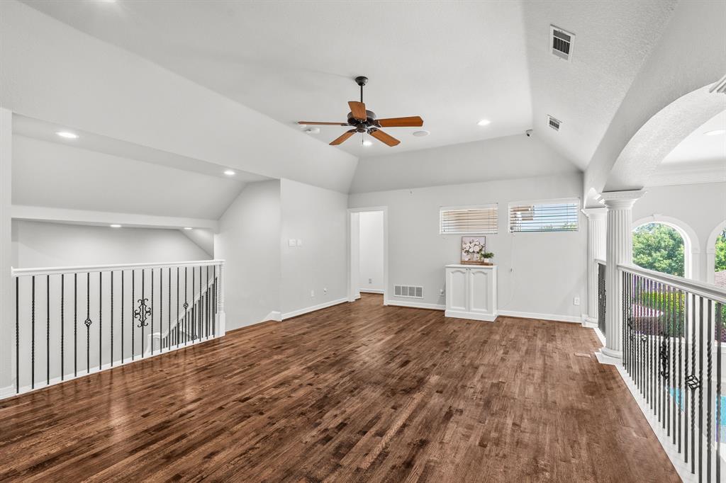 1101 Trail Ridge Drive McKinney, TX 75072 - Photo 20 of 37 a view of a livingroom with wooden floor and a ceiling fan
