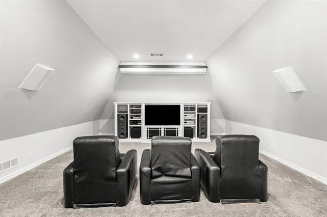 a bedroom with a bed and a ceiling fan