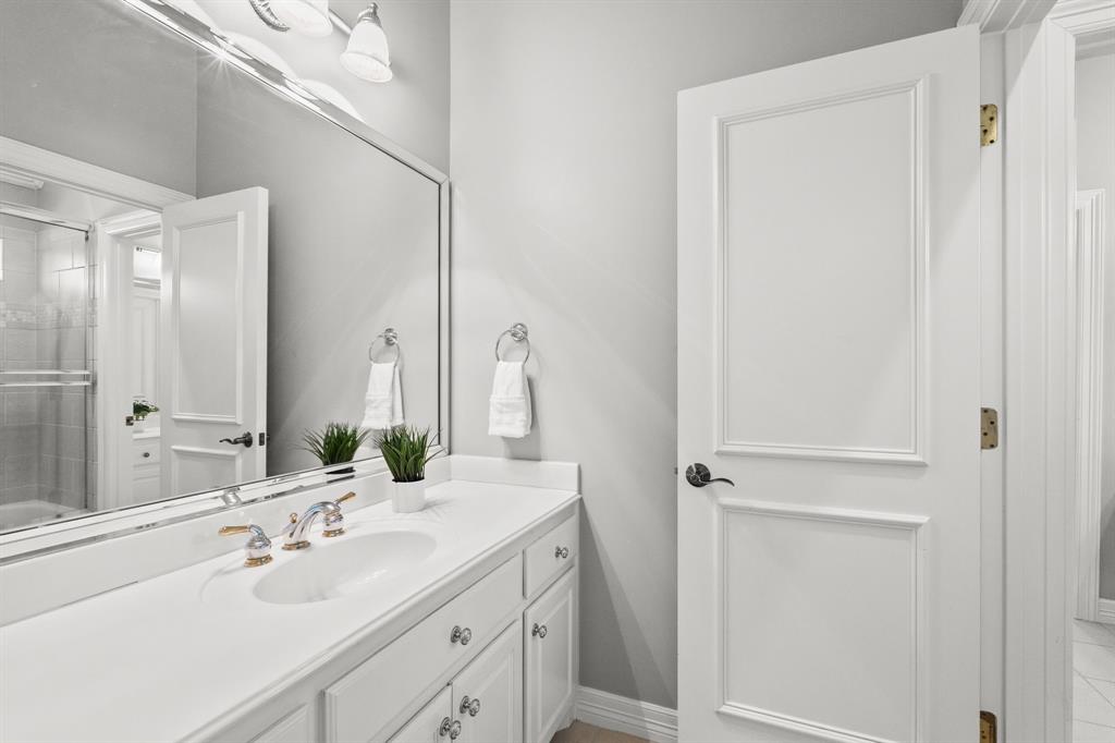 1101 Trail Ridge Drive McKinney, TX 75072 - Photo 24 of 37 a bathroom with a double vanity sink mirror and