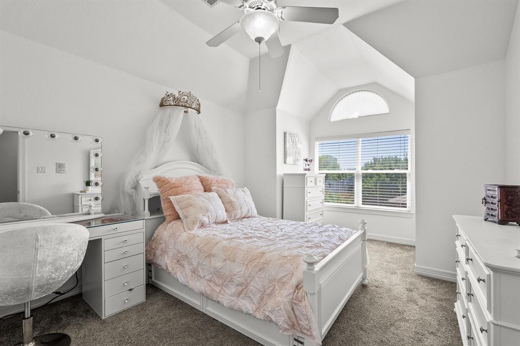 1101 Trail Ridge Drive McKinney, TX 75072 - Photo 26 of 37 a spacious bedroom with a bed and a window