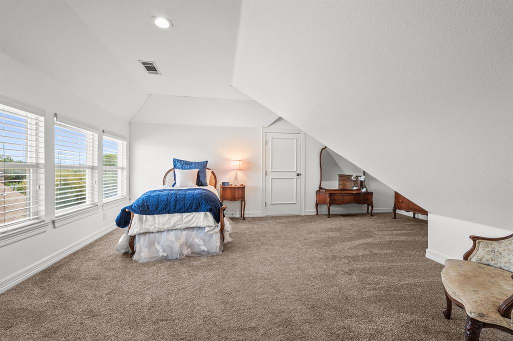 1101 Trail Ridge Drive McKinney, TX 75072 - Photo 28 of 37 a bed room with a bed and a chair