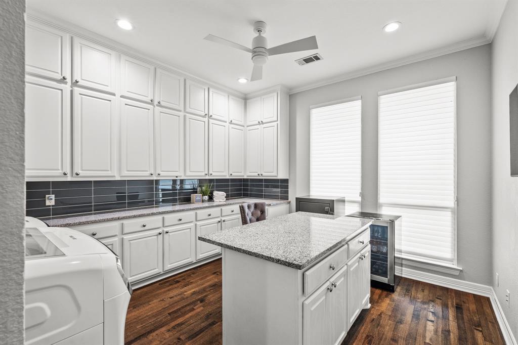 1101 Trail Ridge Drive McKinney, TX 75072 - Photo 30 of 37 a kitchen with a sink stove and cabinets