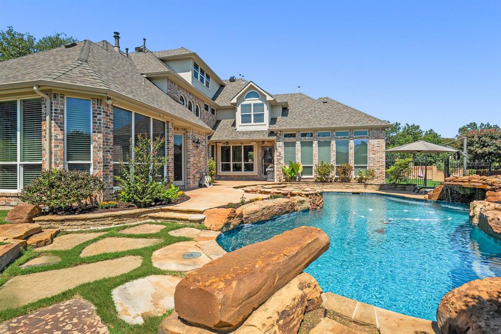 1101 Trail Ridge Drive McKinney, TX 75072 - Photo 31 of 37 a front view of a house with swimming pool having outdoor seating