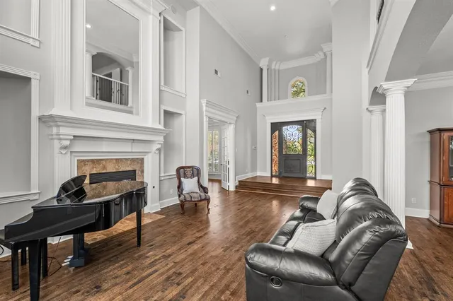 a living room with furniture and a fireplace
