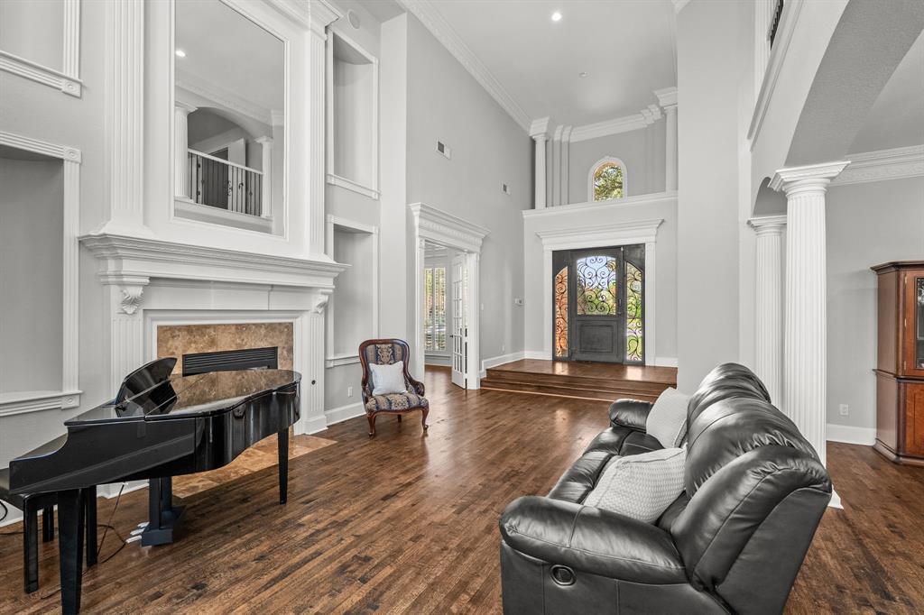 1101 Trail Ridge Drive McKinney, TX 75072 - Photo 7 of 37 a living room with furniture and a fireplace