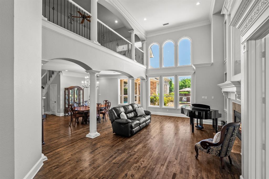 1101 Trail Ridge Drive McKinney, TX 75072 - Photo 8 of 37 a living room with furniture dining table flat screen tv and a large window