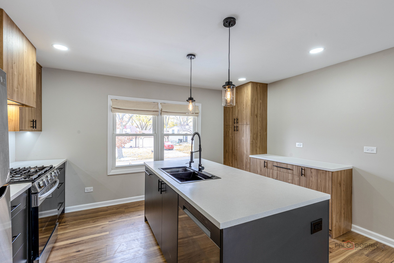 1096 Beechwood Road Buffalo Grove, IL 60089 - Photo 12 of 26 a kitchen with a appliances a sink cabinets and a wooden floor