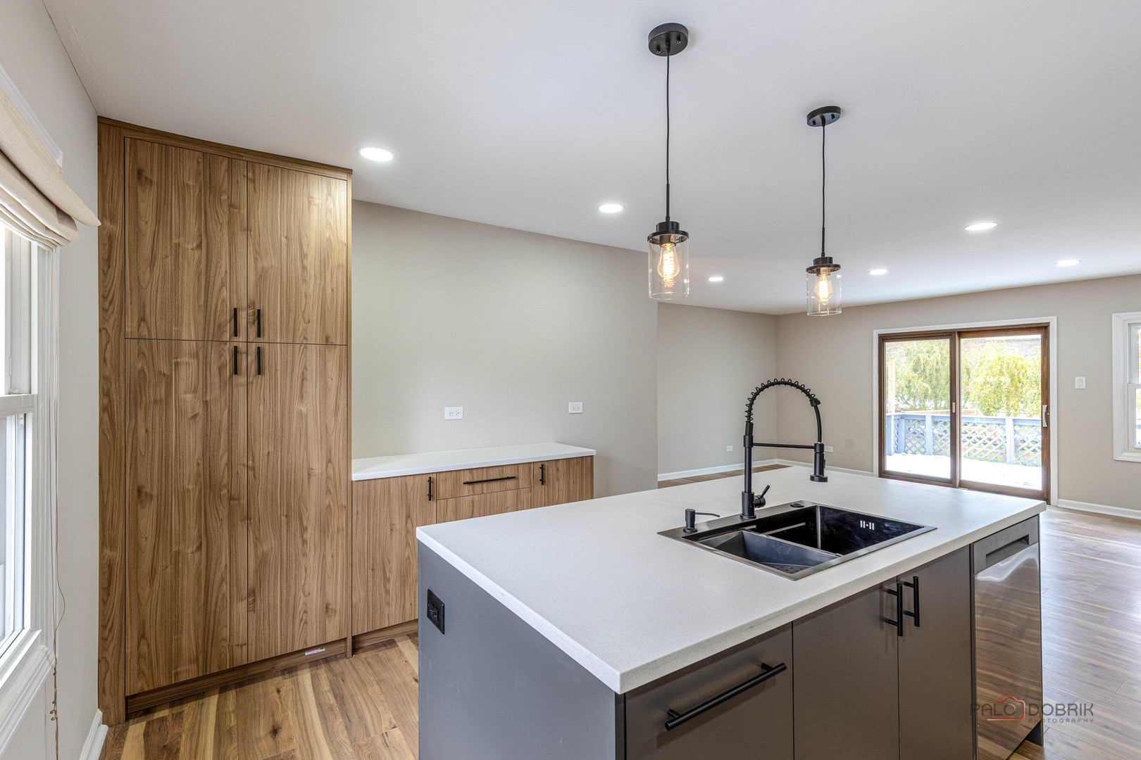 1096 Beechwood Road Buffalo Grove, IL 60089 - Photo 13 of 26 a kitchen with a sink a stove and cabinets