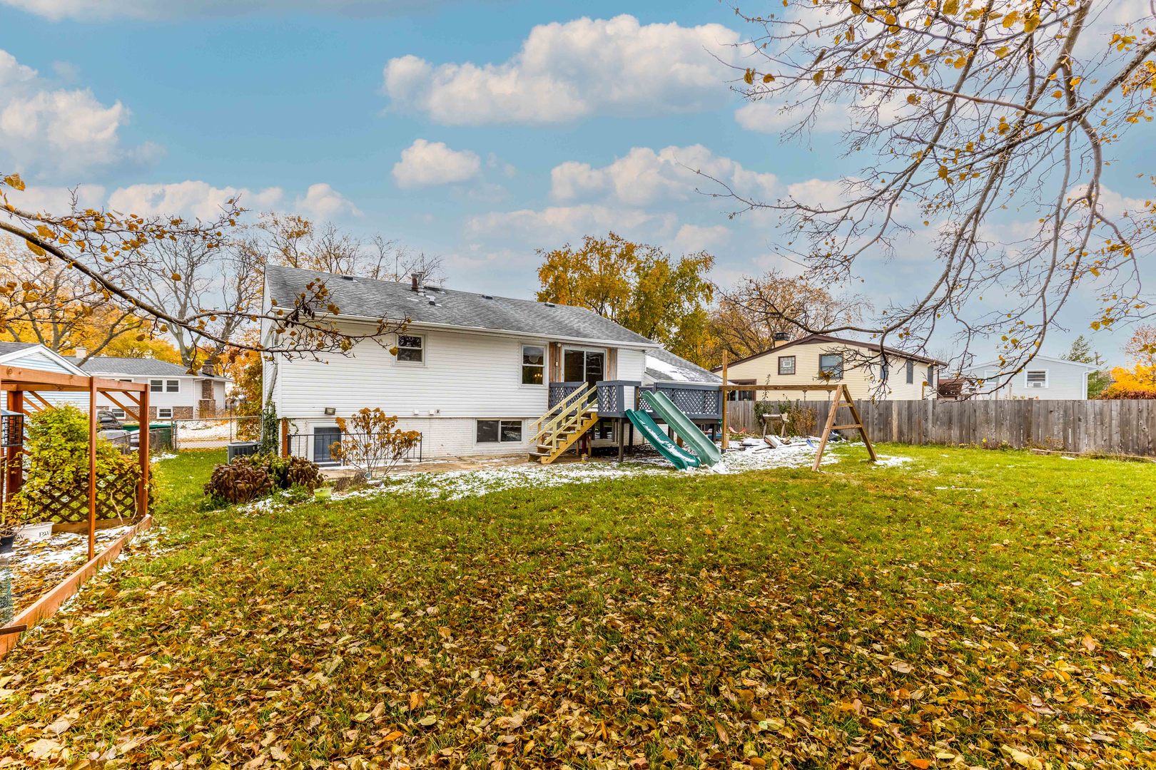 1096 Beechwood Road Buffalo Grove, IL 60089 - Photo 26 of 26 a view of a white house with a yard