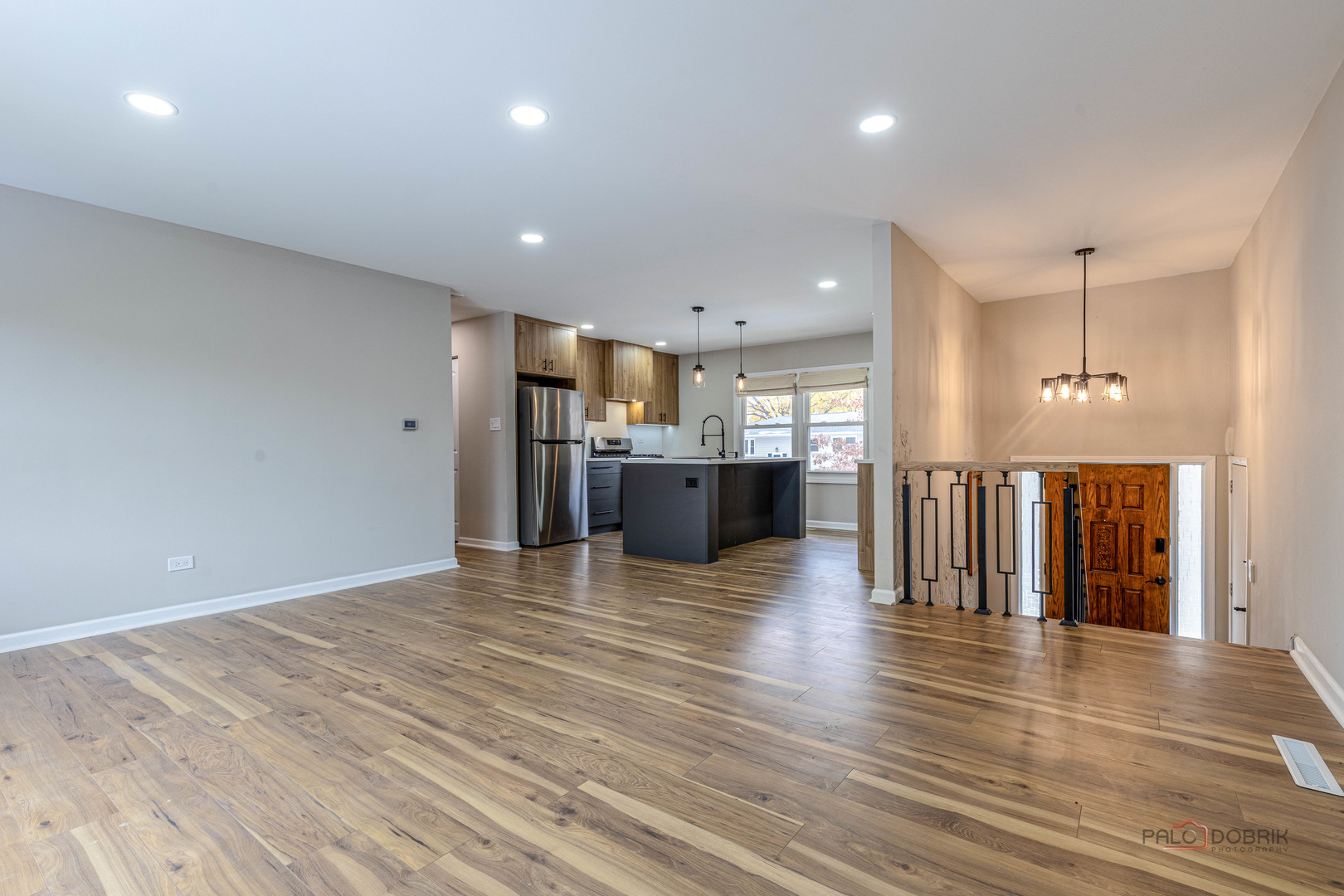 1096 Beechwood Road Buffalo Grove, IL 60089 - Photo 7 of 26 a view of a kitchen with a refrigerator and wooden floor