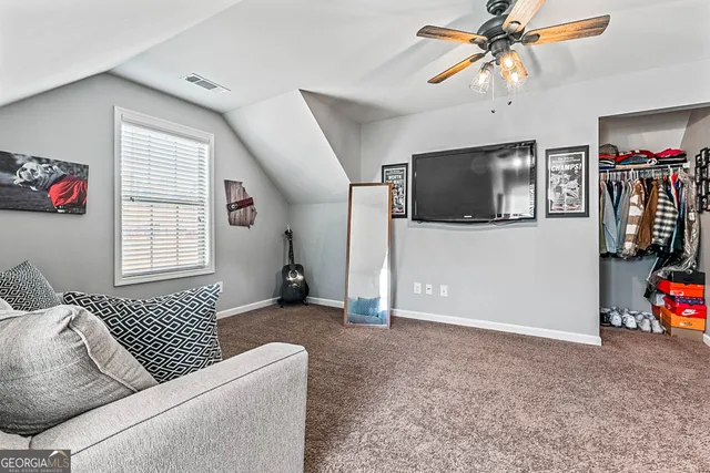 a bedroom with furniture and a wooden floor