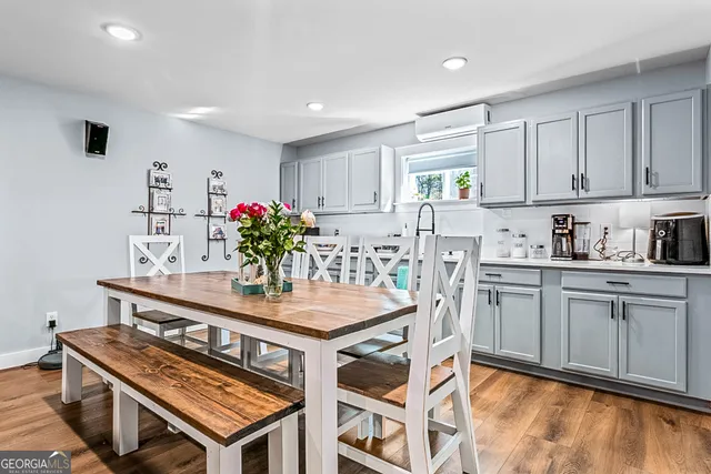 a living room with furniture and a rug