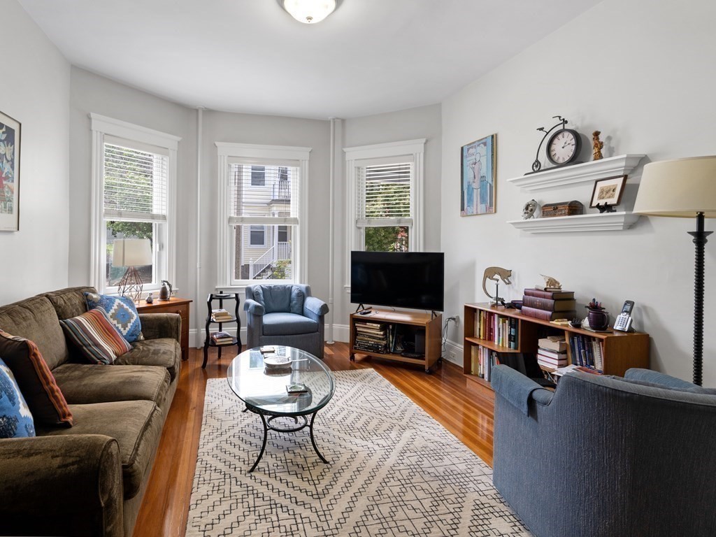 68 Parkton Road, Unit 1 Boston, MA 02130 - Photo 2 of 22 a living room with furniture a flat screen tv and a window