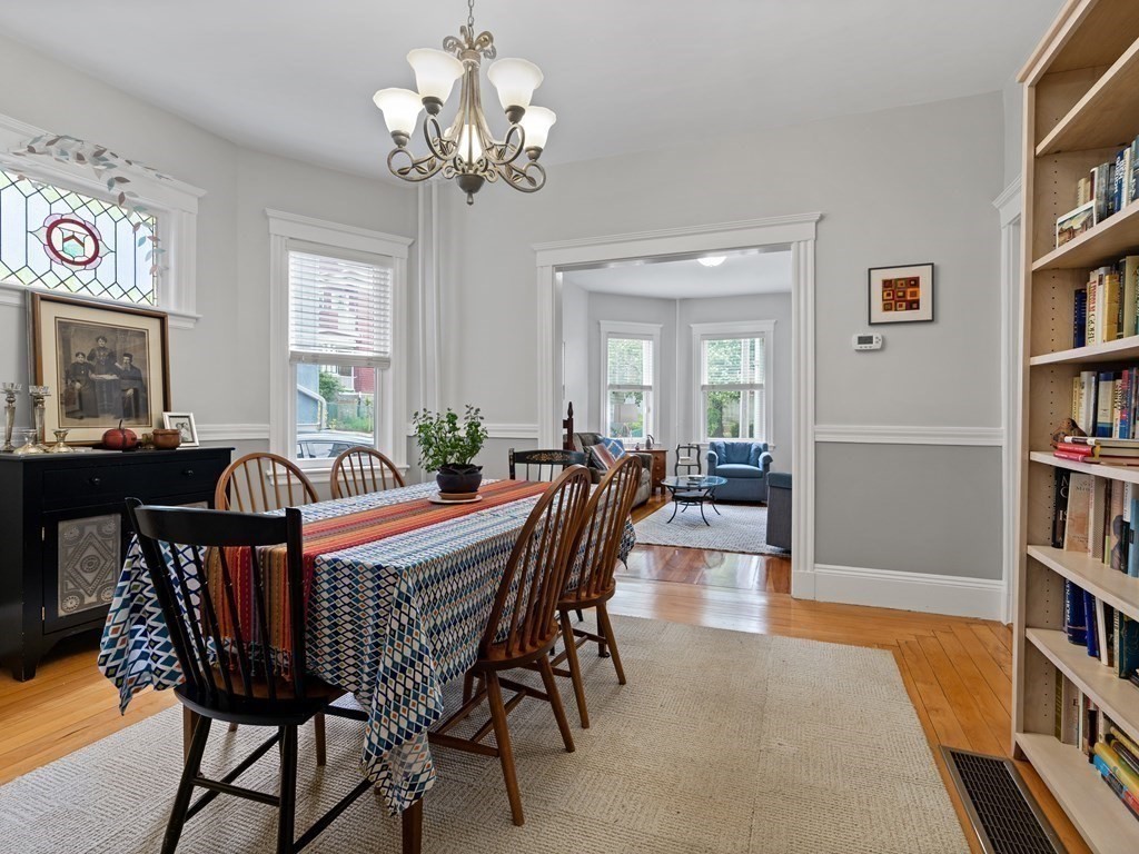 68 Parkton Road, Unit 1 Boston, MA 02130 - Photo 4 of 22 a view of a dining room with furniture and a bookshelf