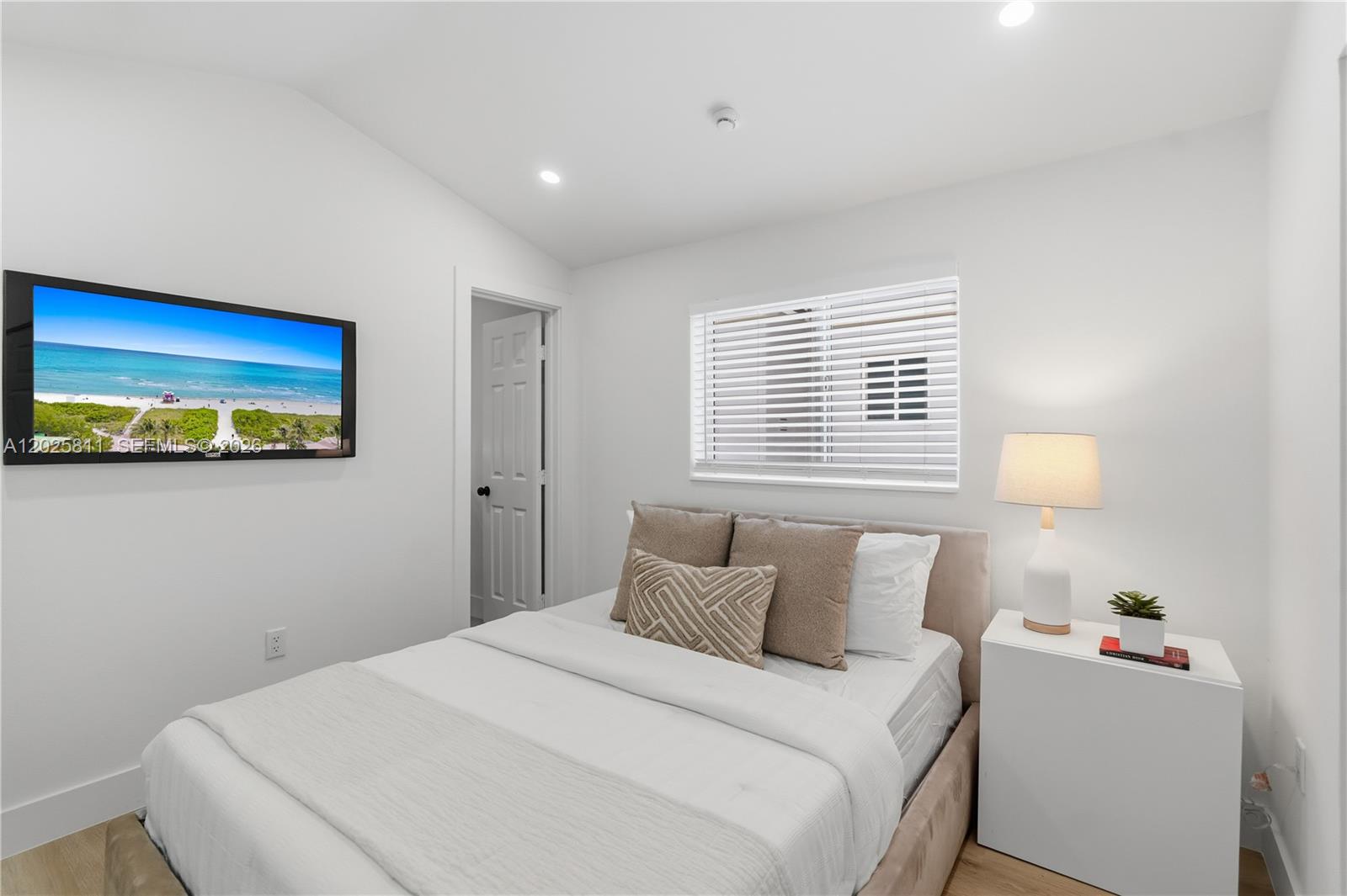 2110 Southwest 15th Street Miami, FL 33145 - Photo 25 of 37 a bedroom with a bed and a window