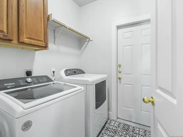 a bathroom with a granite countertop sink a toilet and a mirror