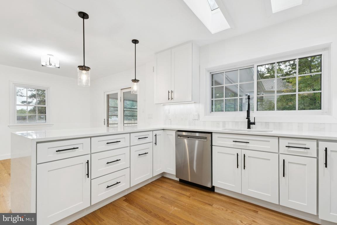 3209 Military Road Arlington, VA 22207 - Photo 12 of 45 a kitchen with cabinets appliances and a window