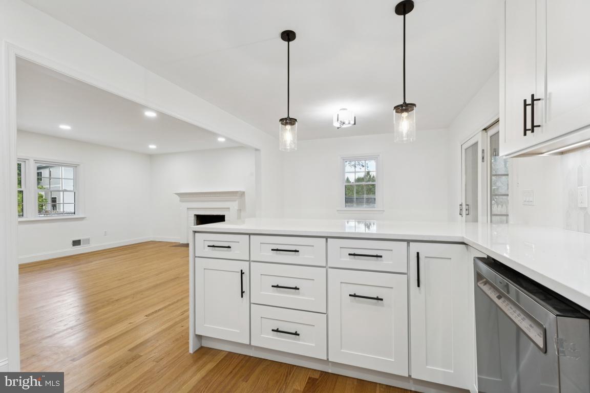 3209 Military Road Arlington, VA 22207 - Photo 13 of 45 a kitchen with white cabinets and sink