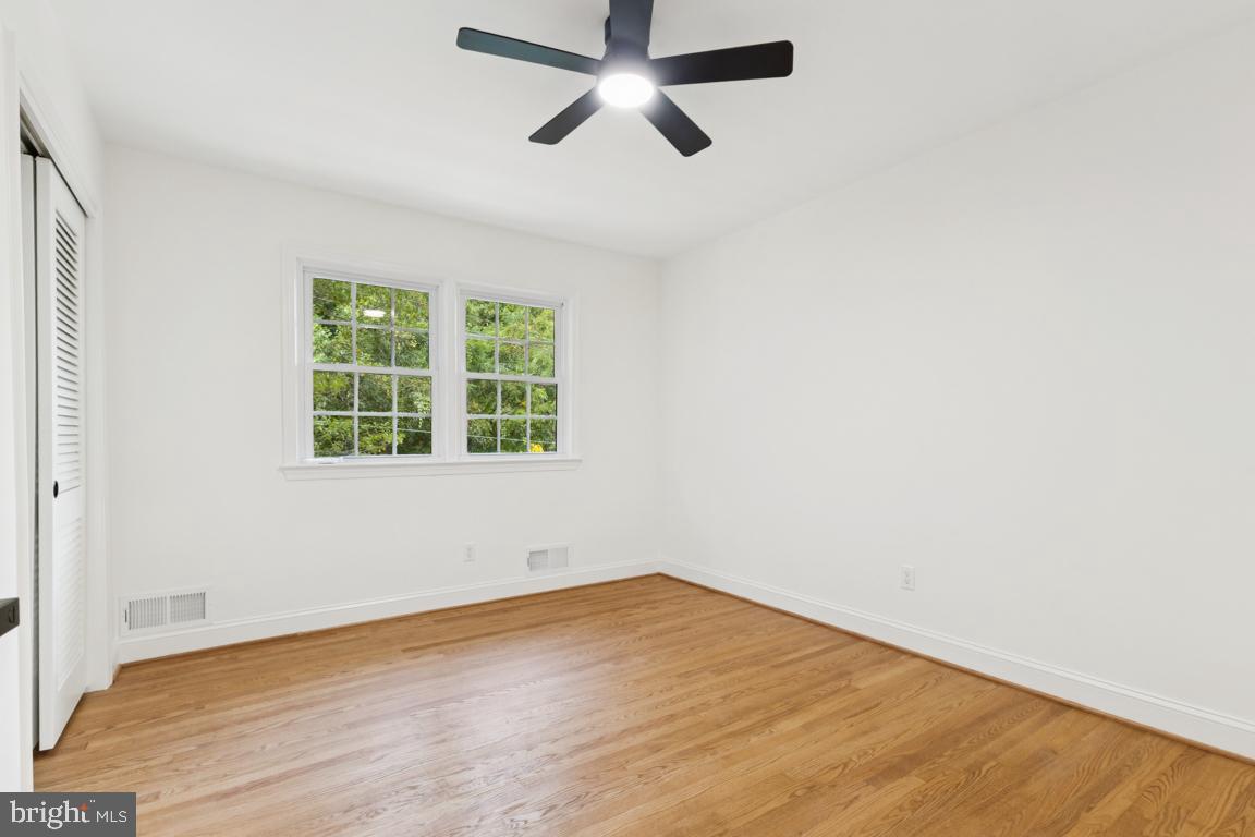 3209 Military Road Arlington, VA 22207 - Photo 20 of 45 an empty room with a window and a ceiling fan