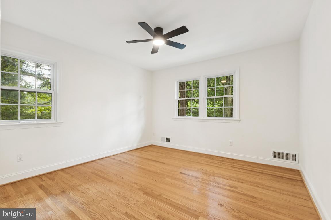 3209 Military Road Arlington, VA 22207 - Photo 22 of 45 an empty room with window and ceiling fan