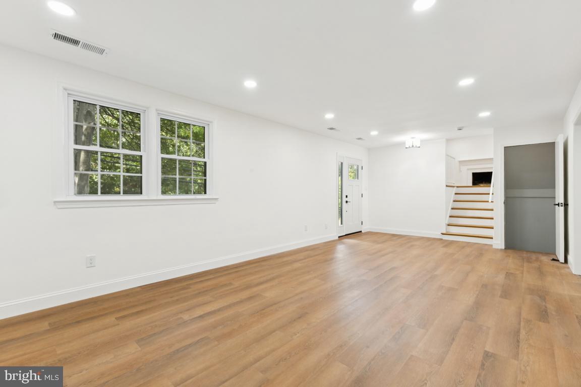 3209 Military Road Arlington, VA 22207 - Photo 31 of 45 an empty room with wooden floor and windows