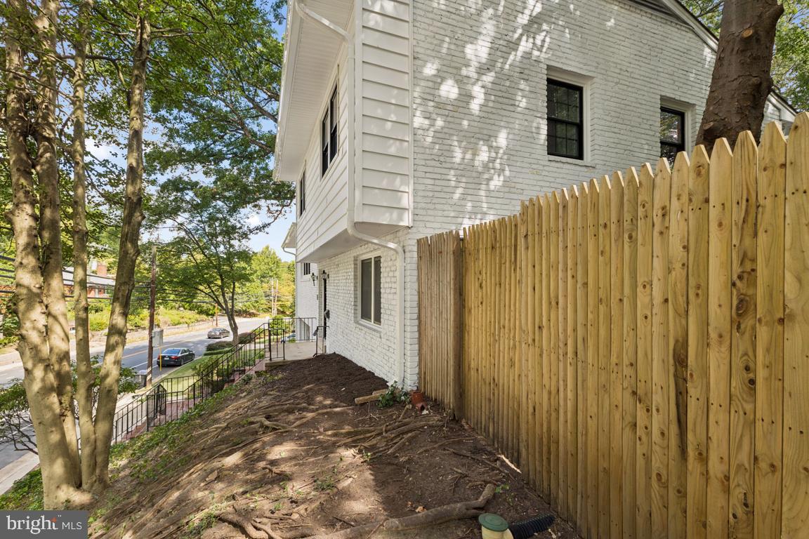 3209 Military Road Arlington, VA 22207 - Photo 4 of 45 a view of a backyard with wooden fence