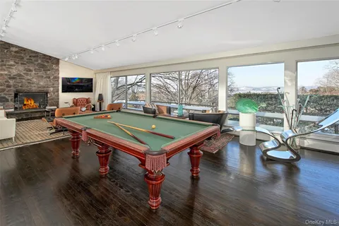 a dining room with wooden floor and a table