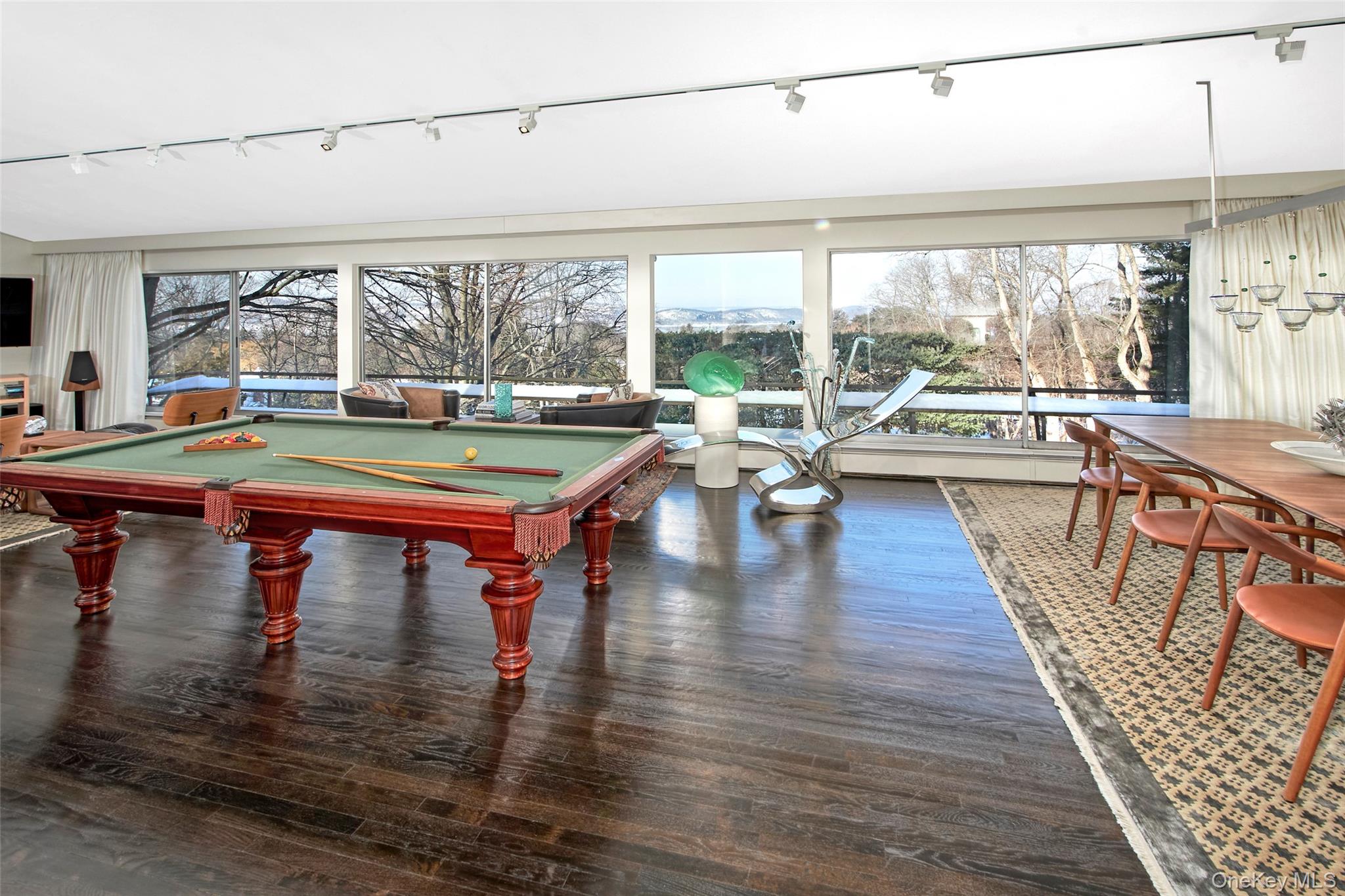 132 Ridgecrest Road Briarcliff Manor, NY 10510 - Photo 13 of 50 a room with lots of tables and large windows