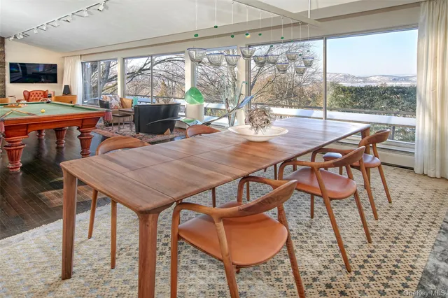 a view of a dining room with furniture window and outside view
