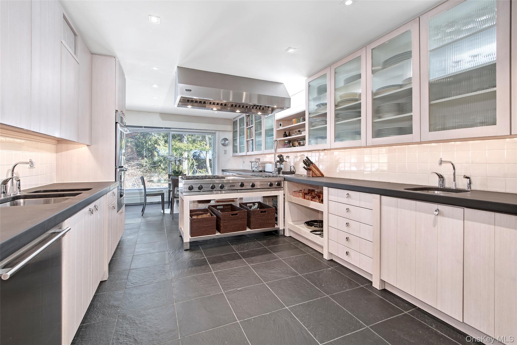 132 Ridgecrest Road Briarcliff Manor, NY 10510 - Photo 20 of 48 a kitchen with stainless steel appliances a stove sink and cabinets