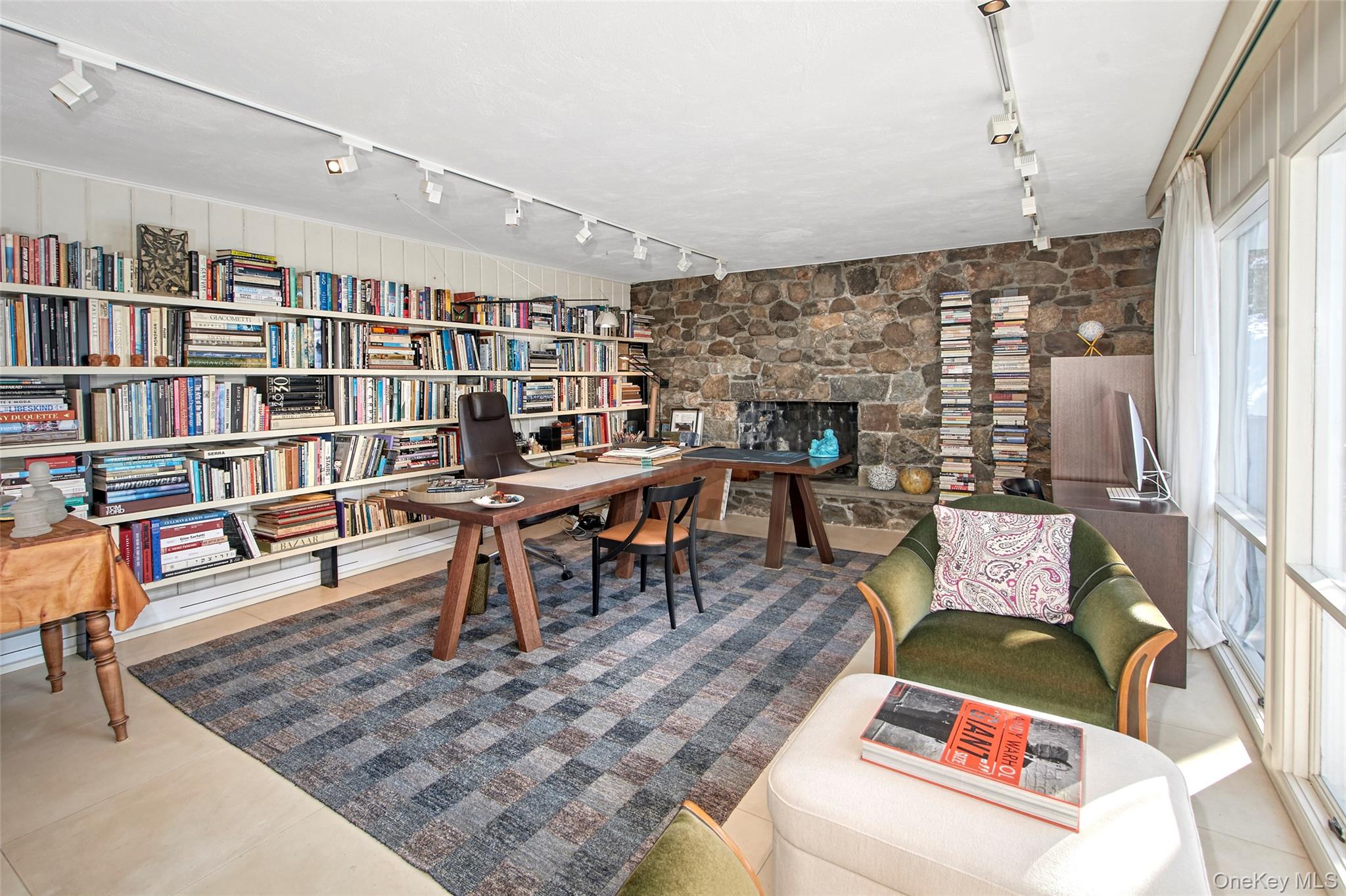 132 Ridgecrest Road Briarcliff Manor, NY 10510 - Photo 27 of 50 a living room with furniture and a book shelf