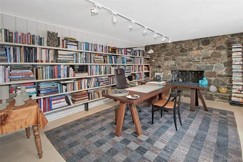 a bed room with a bed and a book shelf