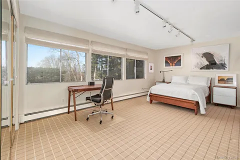 a bathroom with a bathtub a sink and a shower