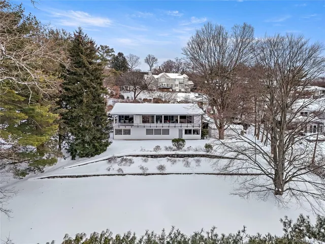 a view of house with outdoor space and sitting area