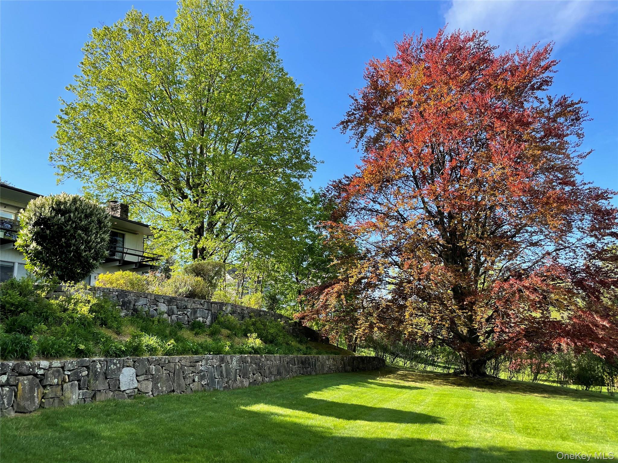 132 Ridgecrest Road Briarcliff Manor, NY 10510 - Photo 7 of 50 a view of a golf course with a garden