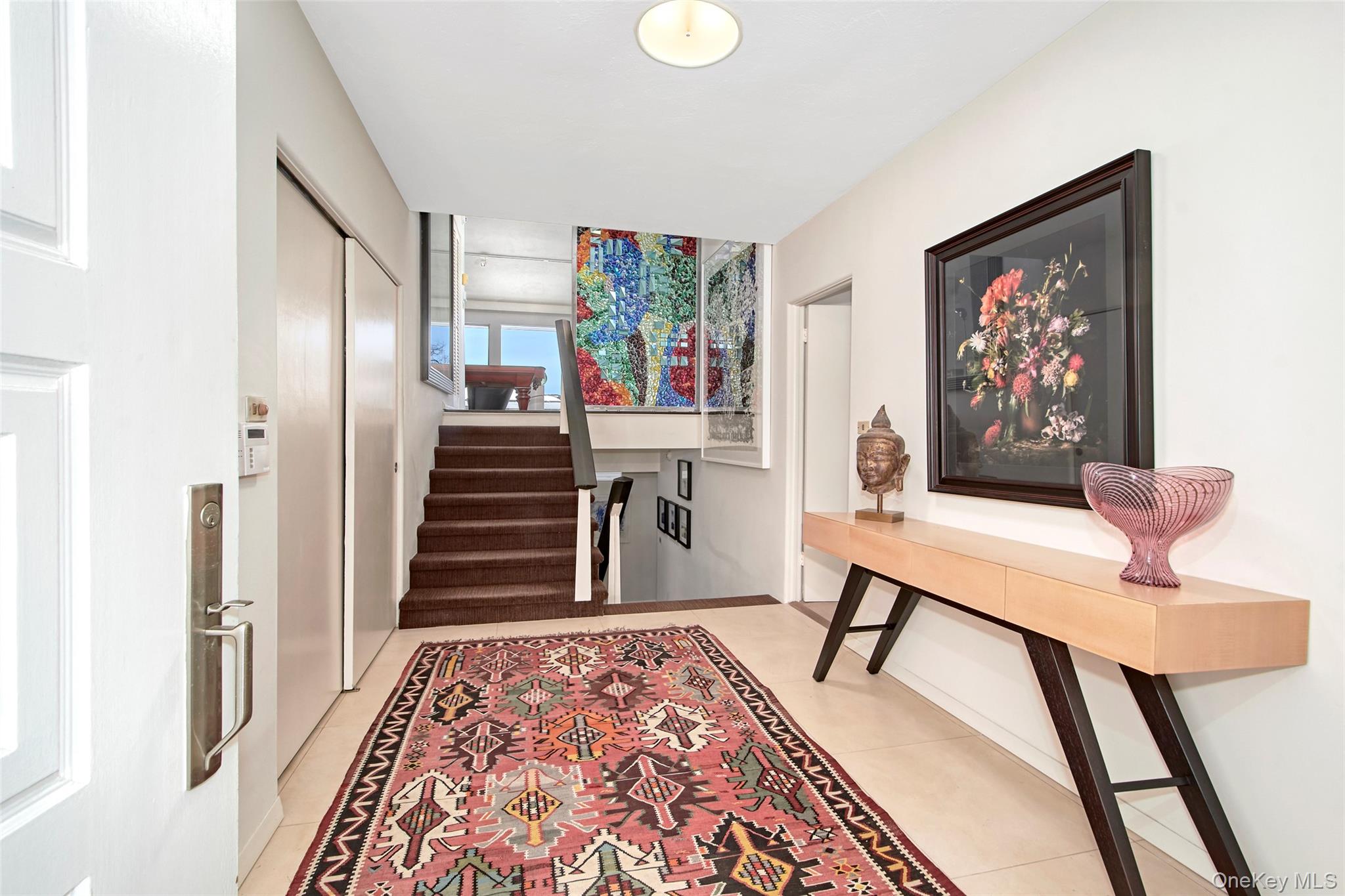 132 Ridgecrest Road Briarcliff Manor, NY 10510 - Photo 9 of 48 a view of a hallway with furniture and stairs