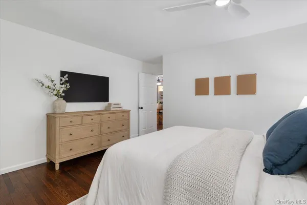 a bedroom with a bed and a dresser