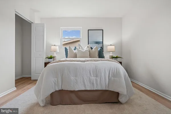 a bedroom with a bed and a mirror