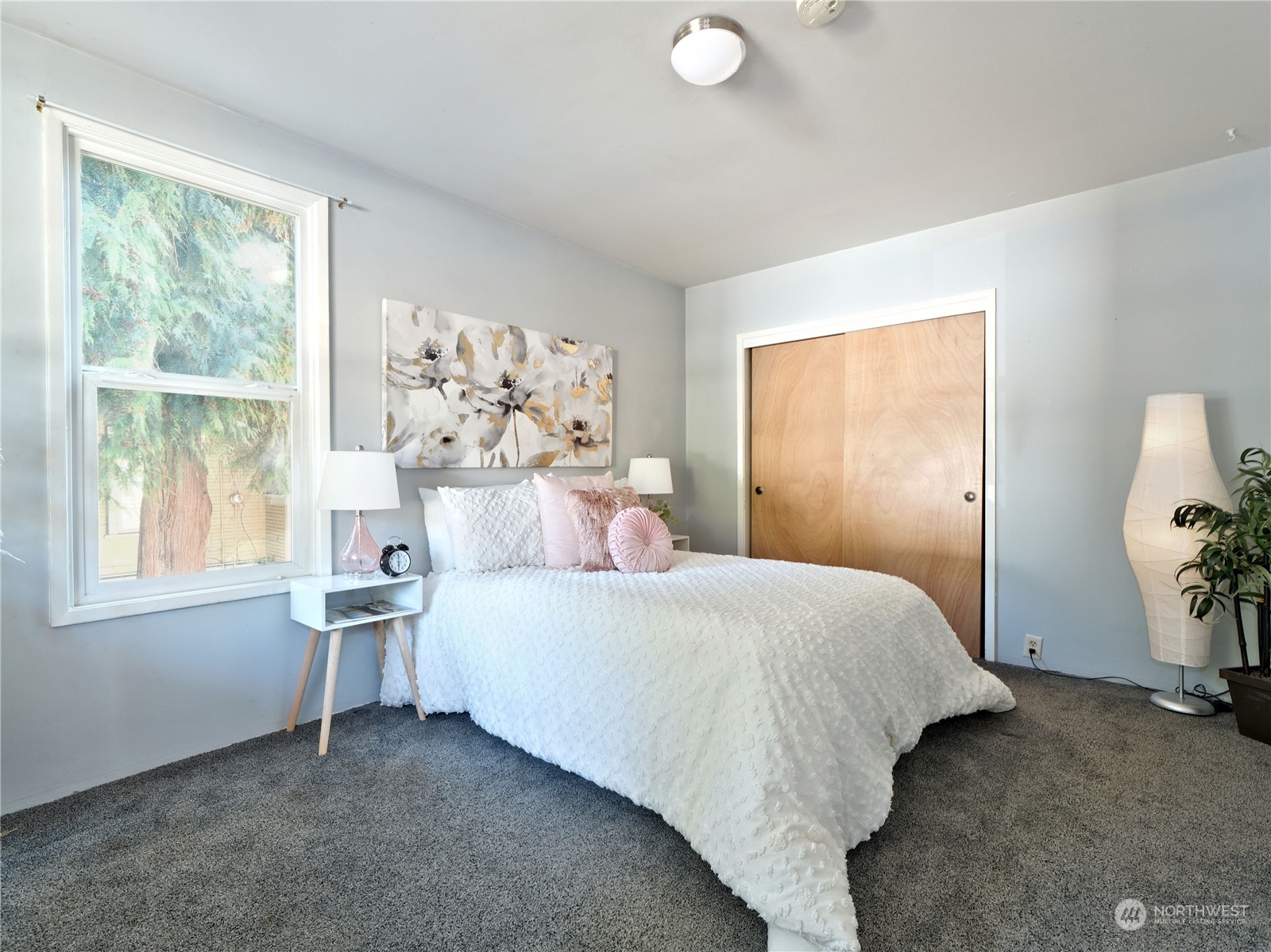 515 Wells Avenue South Renton, WA 98057 - Photo 13 of 25 a bedroom with a bed and a window