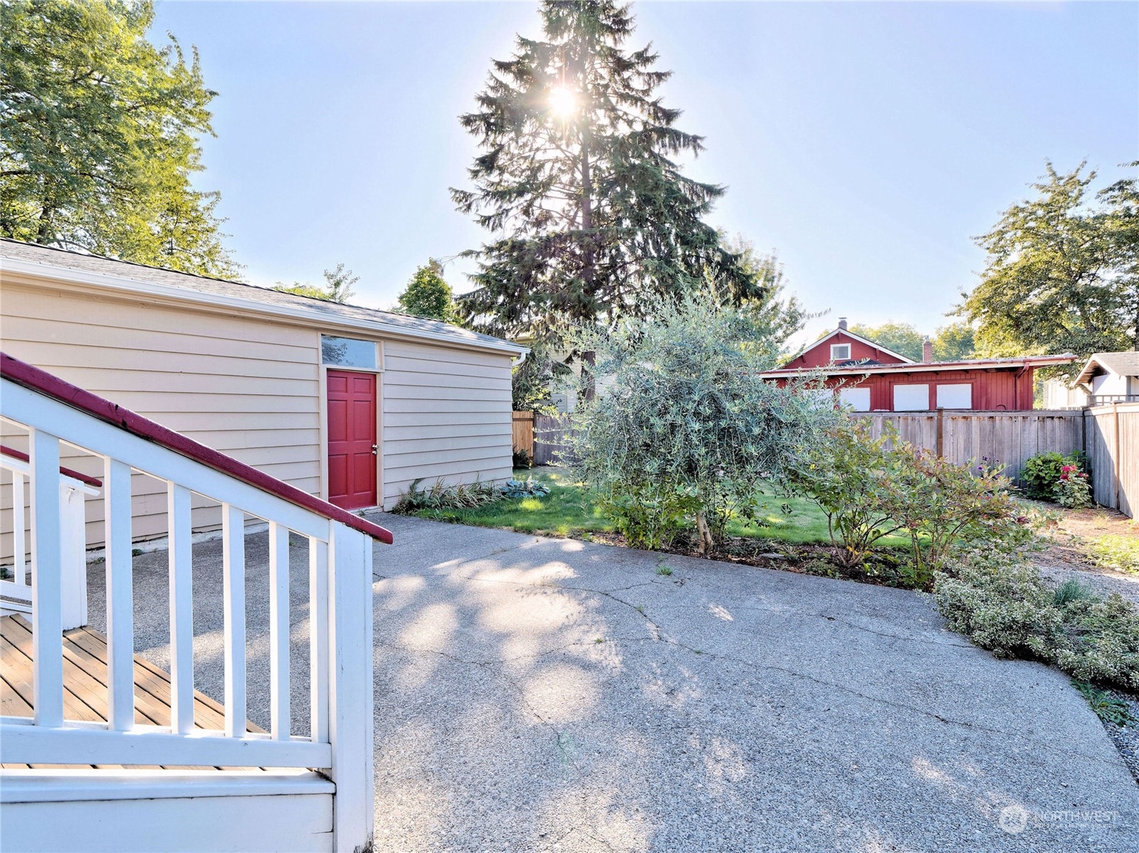 515 Wells Avenue South Renton, WA 98057 - Photo 22 of 25 a view of a house with a yard and potted plants