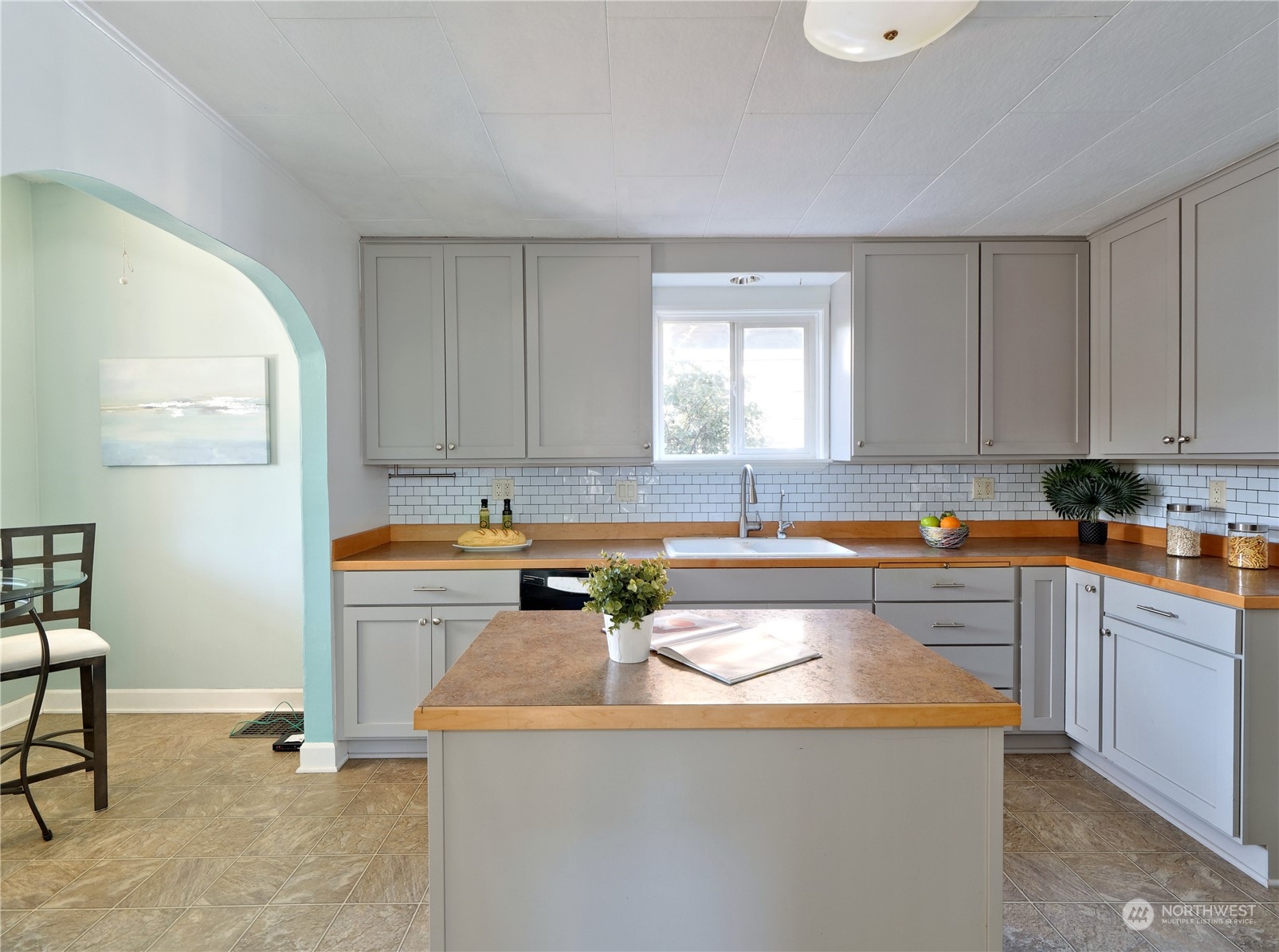 515 Wells Avenue South Renton, WA 98057 - Photo 6 of 25 a kitchen with stainless steel appliances granite countertop a sink stove and cabinets