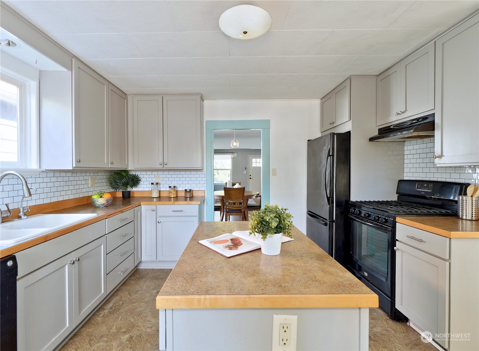 515 Wells Avenue South Renton, WA 98057 - Photo 8 of 25 a kitchen with stainless steel appliances granite countertop a sink stove and refrigerator