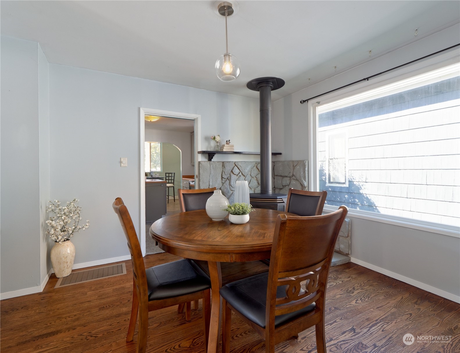 515 Wells Avenue South Renton, WA 98057 - Photo 9 of 25 a view of a dining room with furniture window and wooden floor
