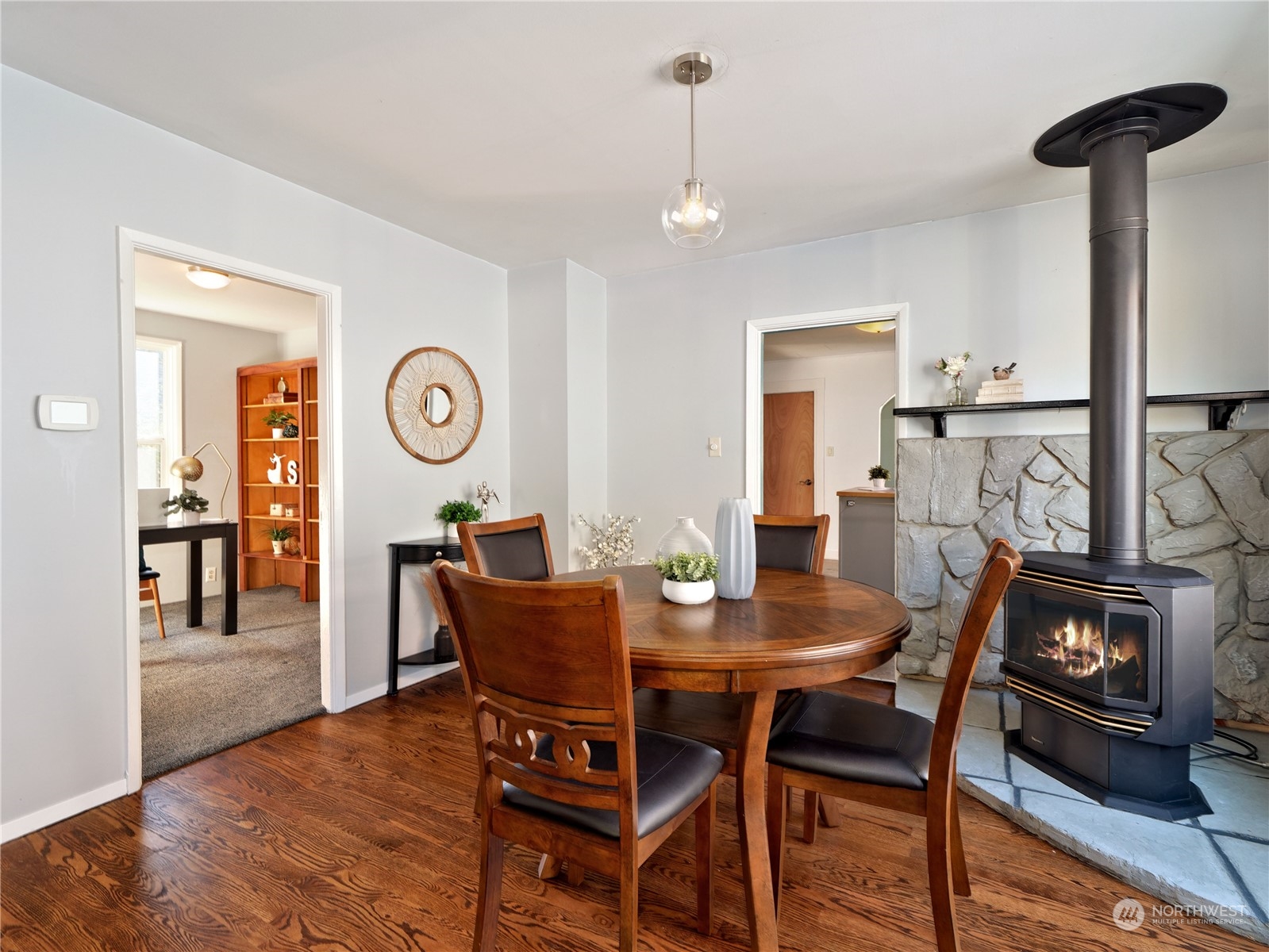 515 Wells Avenue South Renton, WA 98057 - Photo 10 of 25 a view of a dining room with furniture and wooden floor