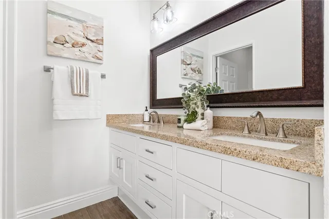 a bedroom with a bed and a night stand