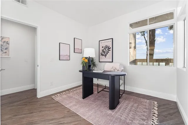 a dining room with furniture and a chandelier
