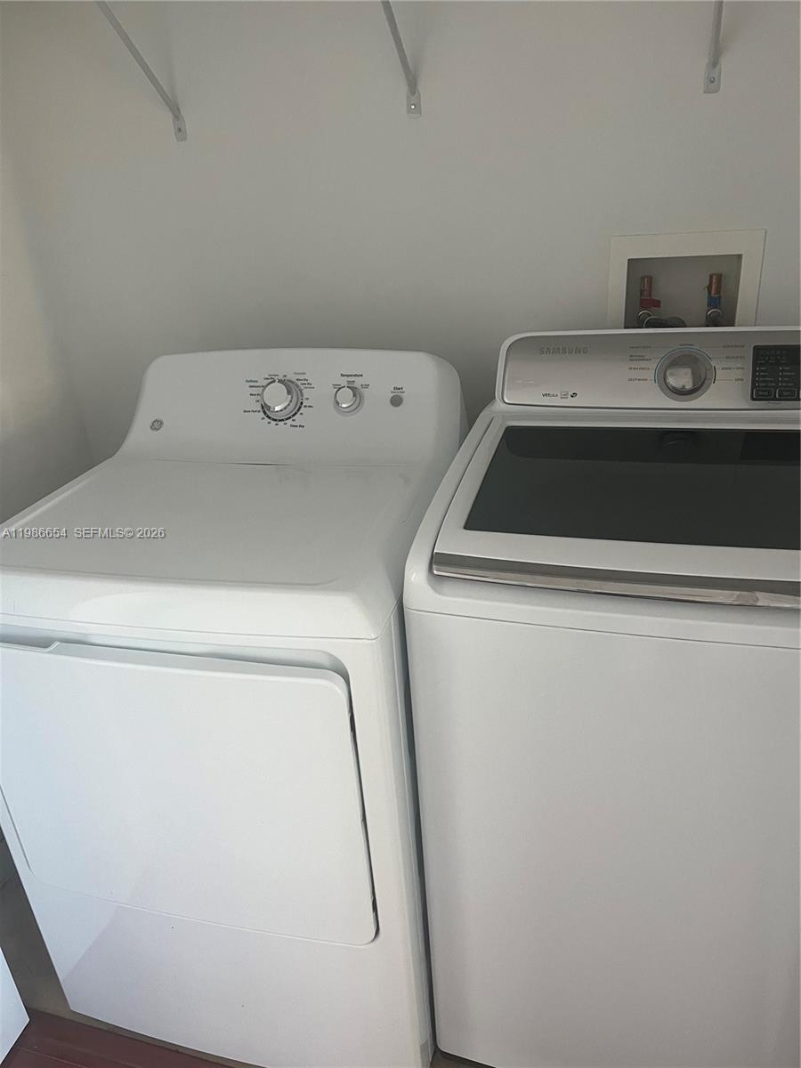 7350 Southwest 89th Street, Unit 1801S Miami, FL 33156 - Photo 11 of 15 a utility room with dryer and washer