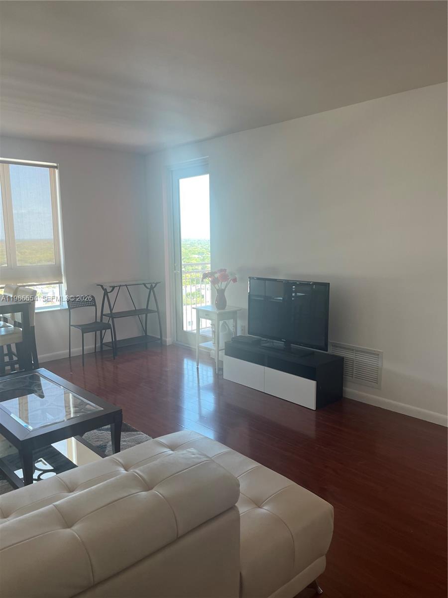 7350 Southwest 89th Street, Unit 1801S Miami, FL 33156 - Photo 5 of 15 a living room with furniture and a potted plant
