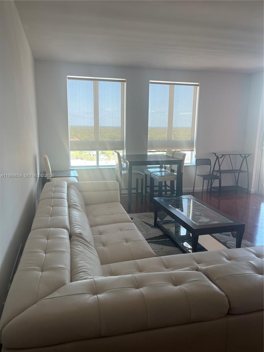 7350 Southwest 89th Street, Unit 1801S Miami, FL 33156 - Photo 6 of 15 a living room with furniture and a large window