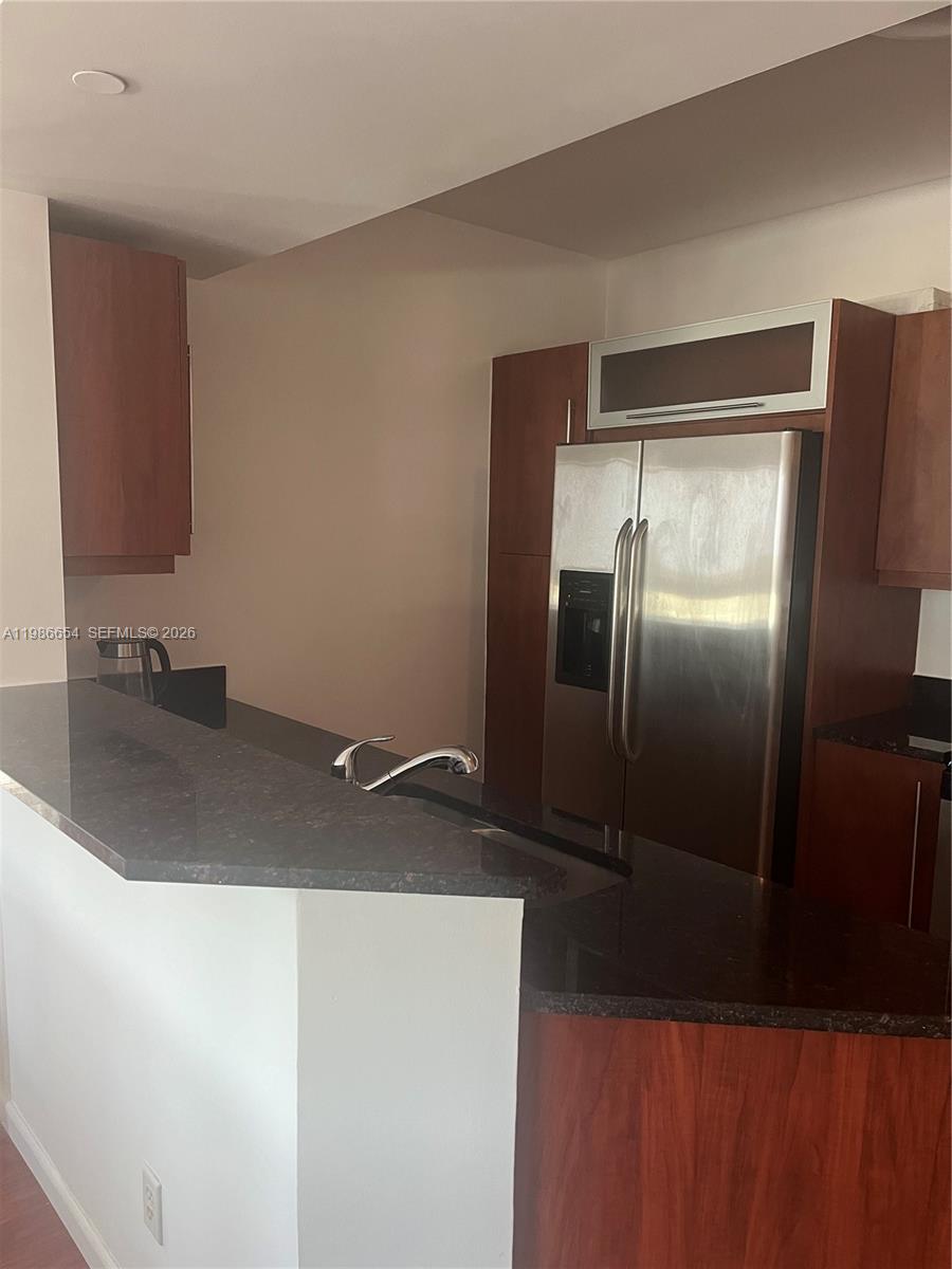 7350 Southwest 89th Street, Unit 1801S Miami, FL 33156 - Photo 8 of 15 a close view of a sink and a refrigerator